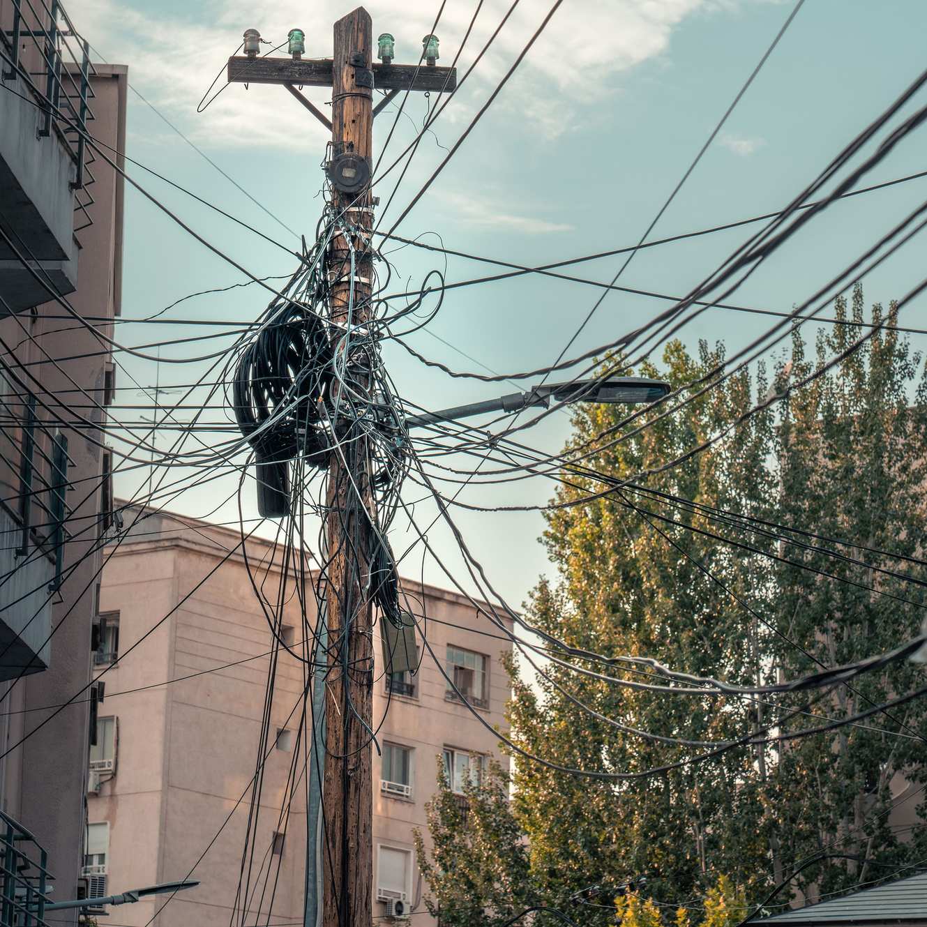 Urban electric cables and wiring on a street infrastructure pole